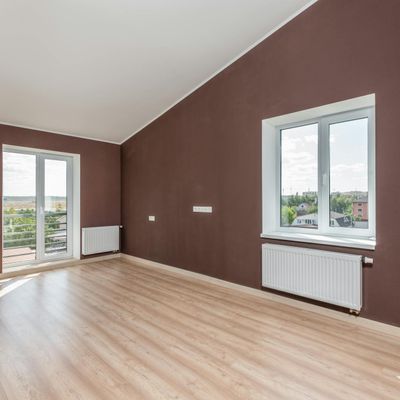 Bright and empty exercise room with large windows